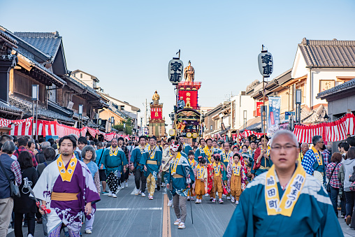 Saitama Prefecture, Kawagoe City, October 21, 2018: Kawagoe Festival, festival car down the street and the crowd following it.