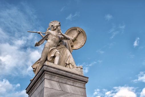 Berlin, Germany - December 9, 2019: The sculpture on the Schloss Bridge Schlossbruecke - Greek goddess Athena protects the young hero. By Gustav Blaeser, 1854
