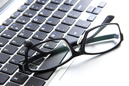 Eyeglasses on the laptop computer