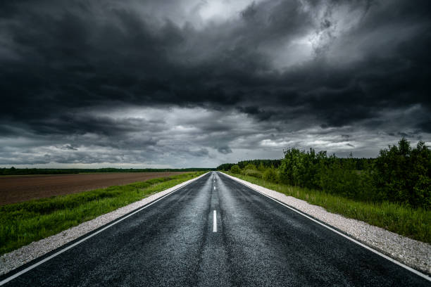 istock Road at stormy weather 1247700013