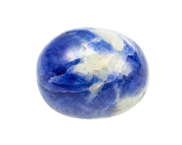 istock Lazurite (lapis) gem stone isolated on white 1247702876
