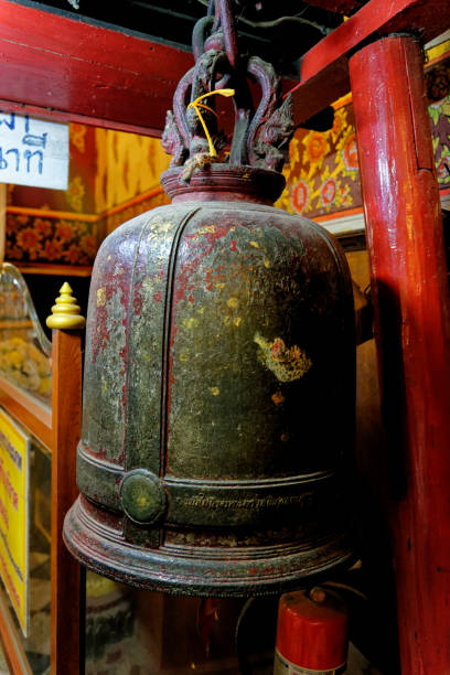 Steel Bell Hang in Wat Phanan Choeng temple Steel Bell Hang in Wat Phanan Choeng temple, Ayutthaya, UNESCO World Heritage Site, Thailand, Southeast Asia, Asia - 21st of January 2020 wat phananchoeng stock pictures, royalty-free photos & images