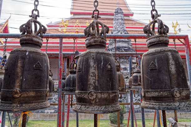 Steel Bell Hang in Wat Phanan Choeng temple Steel Bell Hang in Wat Phanan Choeng temple, Ayutthaya, UNESCO World Heritage Site, Thailand, Southeast Asia, Asia - 21st of Jnuary 2020 wat phananchoeng stock pictures, royalty-free photos & images