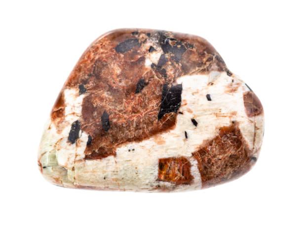 istock polished Spreustein (Natrolite) rock isolated 1247708288