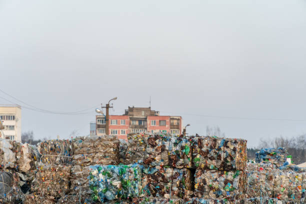 Mogilev, Belarus - April 8 2019: Used polyethylene and plastic cardboard baled in a warehouse for sorting and recycling. The concept of separate garbage collection and environmental protection. Mogilev, Belarus - April 8 2019: Used polyethylene and plastic cardboard baled in a warehouse for sorting and recycling. The concept of separate garbage collection and environmental protection. balasore stock pictures, royalty-free photos & images