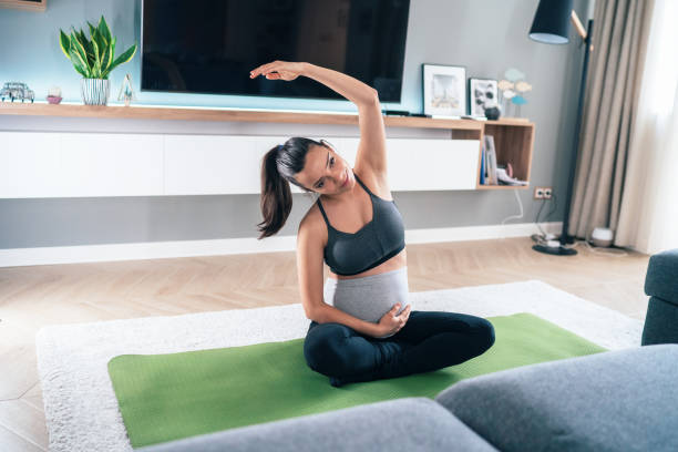 istock Pregnant women doing yoga 1247728284
