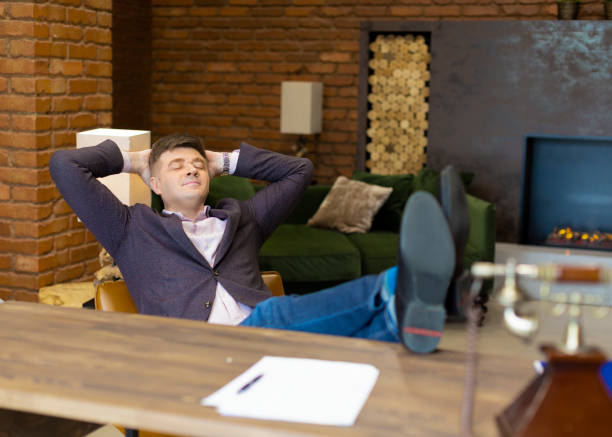 istock Happy businessman having rest after successful negotiations and contracting 1247733285