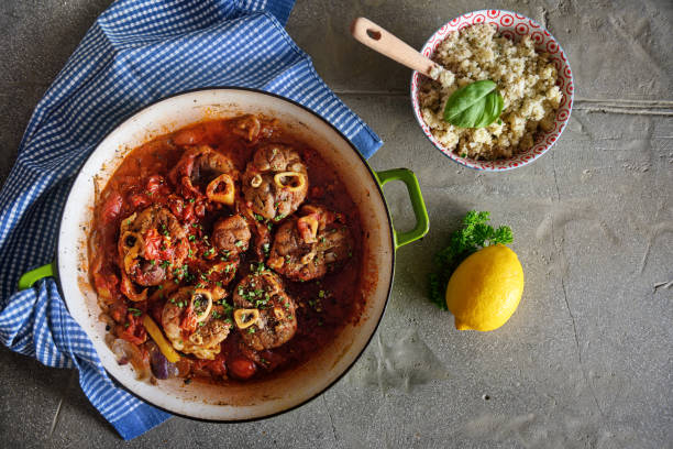 Diverse Keto Dishes Keto Osso Buco cooking in tomato sauce with lemon and peppers, served with cauliflower rice, Quebec, Canada ossobuco stock pictures, royalty-free photos & images