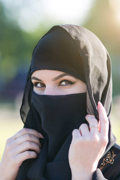 istock Arab woman in a black scarf on her head. 1247733364