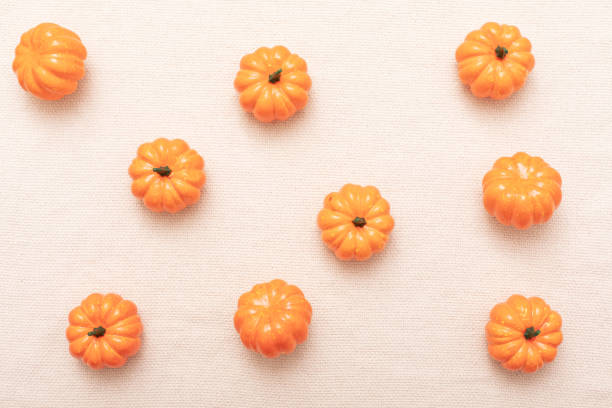 Pumpkin on beige background. Autumn fall Seasonal concept.