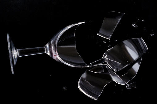 close-up of broken dishes on a black background