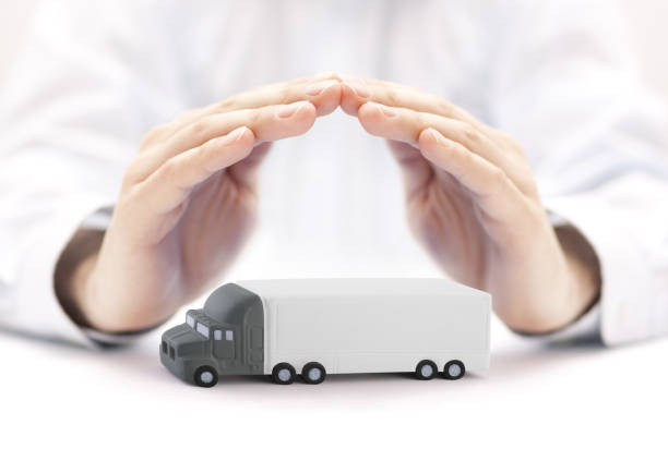 istock Long truck with a trailer protected by hands 1247755776