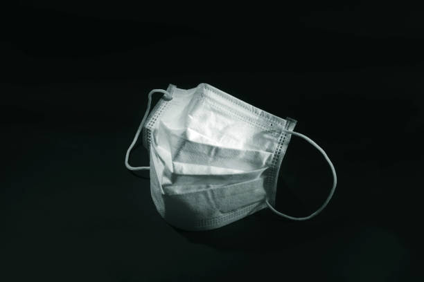 istock Mask to protect against corona(COVID-19) virus (black background) 1247759158