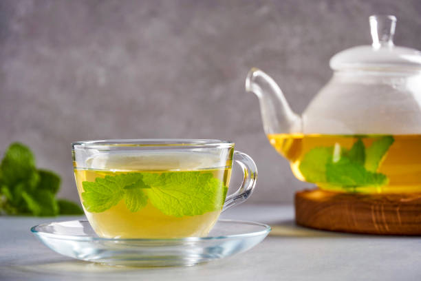 istock Fresh natural melissa , lemon balm herbal tea in glass cup. 1247760512