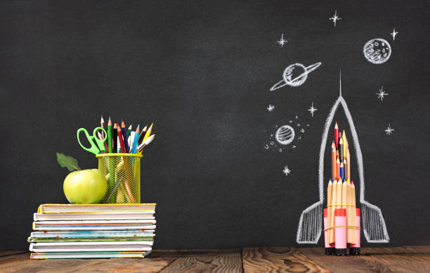 istock Back to School Concept with Hand Drawn Rocket on Blackboard 1247762910