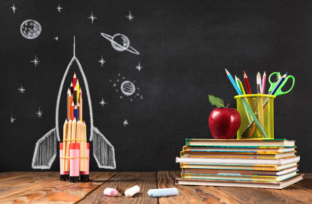 istock Back to School Concept with Hand Drawn Rocket on Blackboard 1247765901