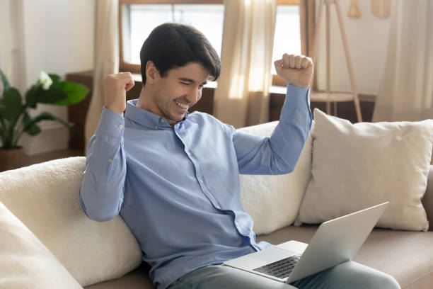 istock Excited caucasian man get pleasant email on laptop 1247767115