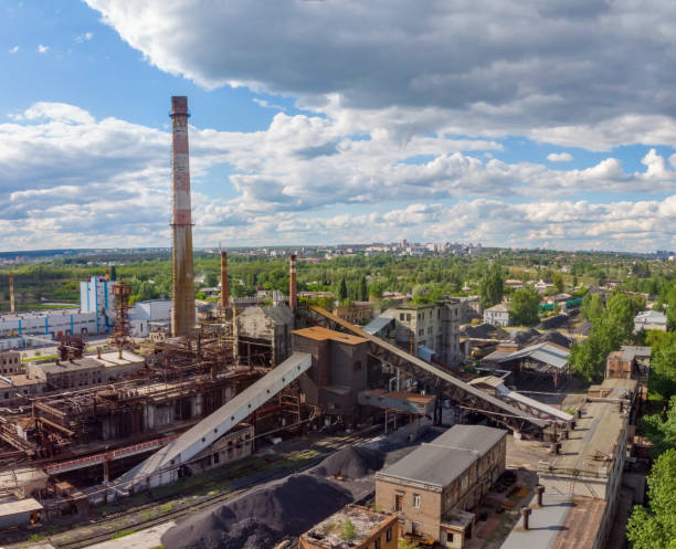 istock Aerial drone shot of old industrial zone with smoke stack. Air pollution concept 1247770033