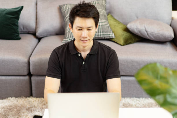 istock business asian man working with computer laptop and having business phone conversation 1247790187