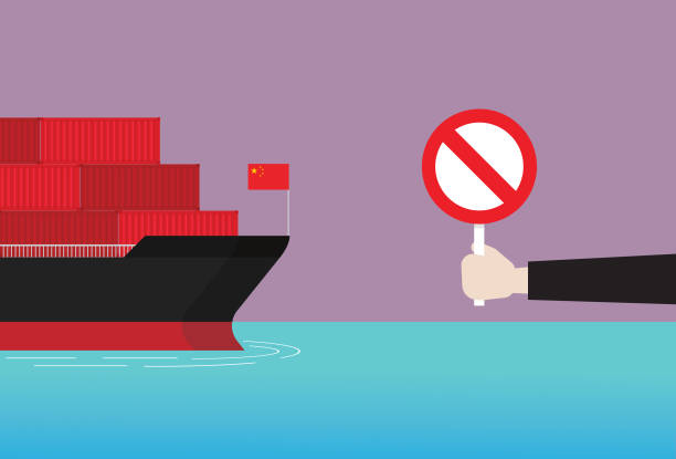 istock Businessman show prohibition sign to a cargo ship from China 1247790732