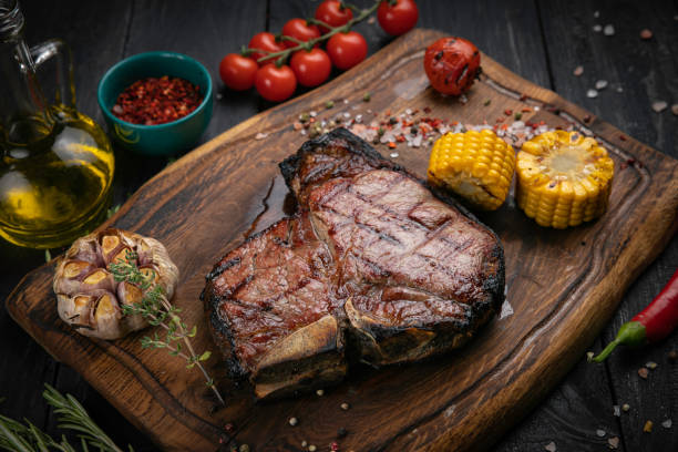 BBQ dry aged Steak sliced T-bone steak BBQ dry aged Steak sliced T-bone steak. On a wooden board porterhouse steak stock pictures, royalty-free photos & images