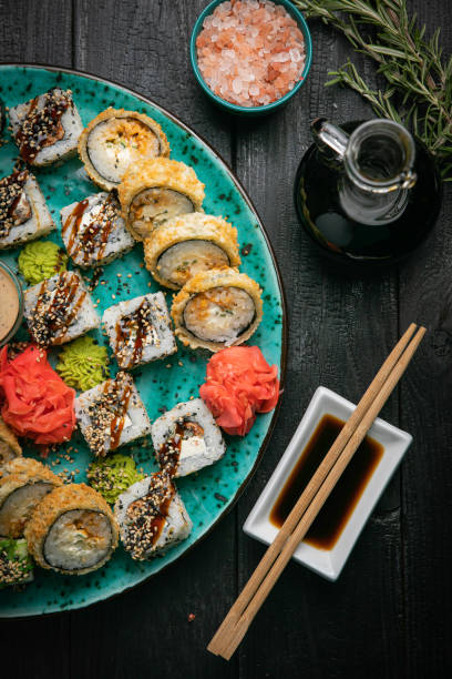istock Seafood rolls on a plate on a wooden background 1247791525