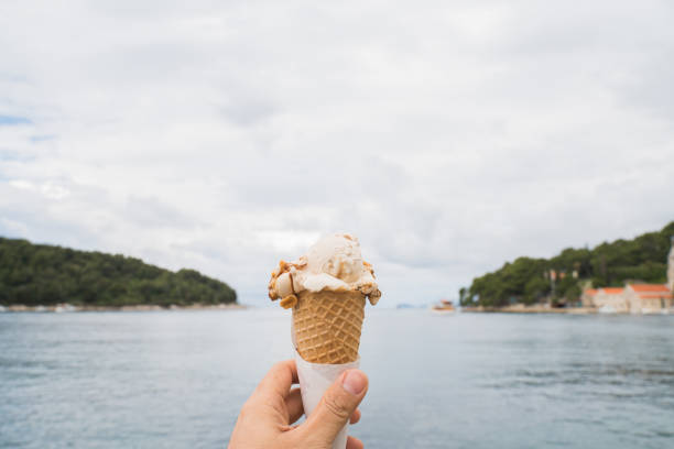 Hand holding ice cream cones