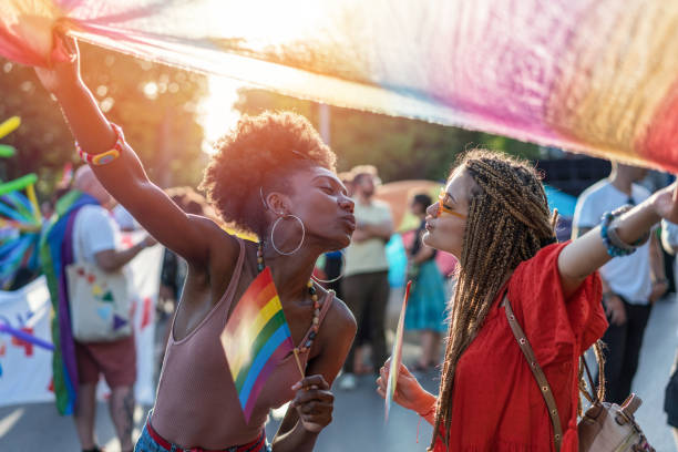 istock Lovely couple dancing at the pride parade 1247798828