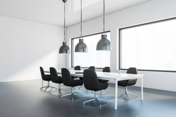 istock White meeting room corner with black chairs 1247799531