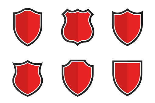 Set of shields in different shapes. Conceptual symbol of protection, safety, security and guarding. Red shields isolated on background. Vector