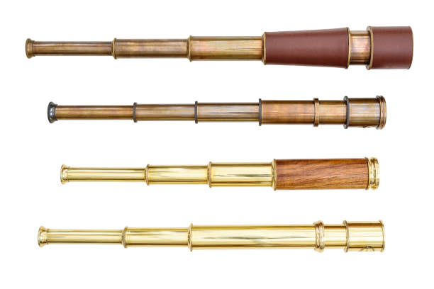 istock Set of monoscope : Nautical handheld brass pirate navigation telescope, zoomable vintage adjustable telescopic monocular optic, retro look, sea marine telescope, used by a sailor. Isolated on white 1247800445