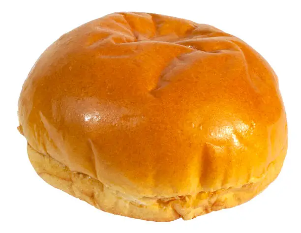 Freshly baked brioche bun isolated on white.