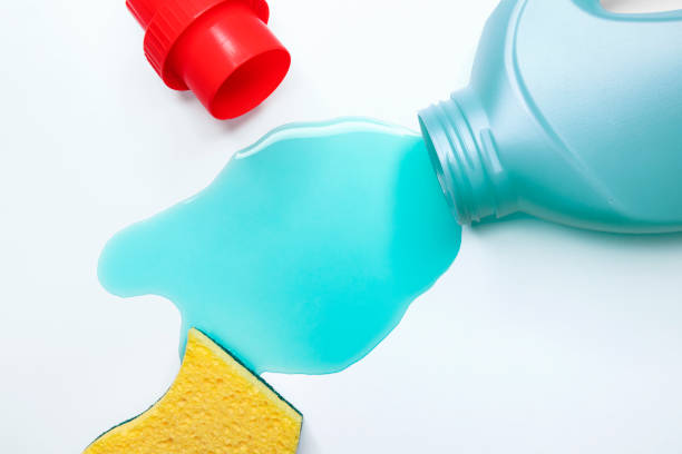 Blue liquid detergent spilled on the table, close-up