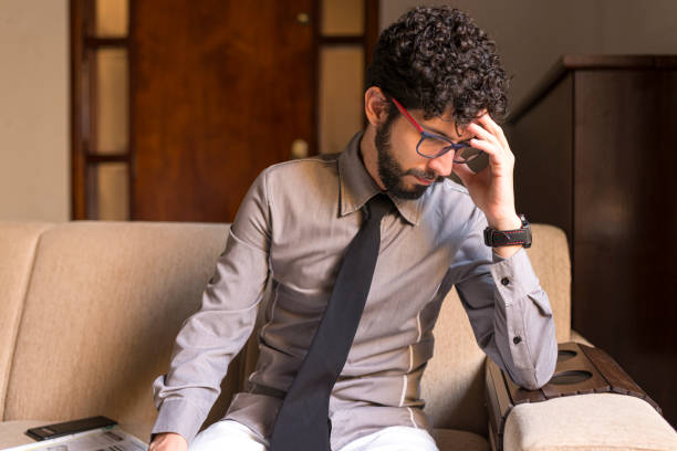 istock Depressed unemployed young man at his home 1247803742