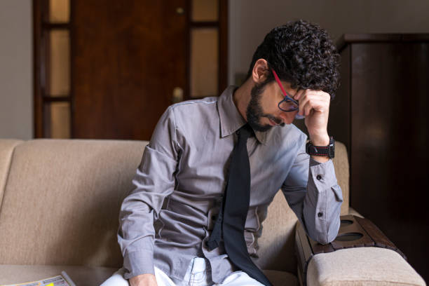 istock Hispanic unemployed in his home worried about debts 1247803871