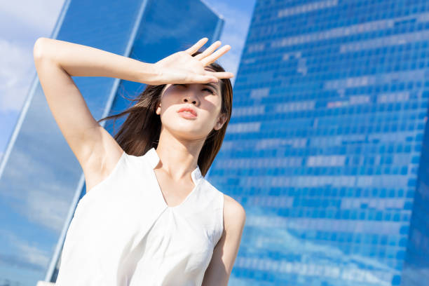 istock Asian woman afraid of sun 1247804580