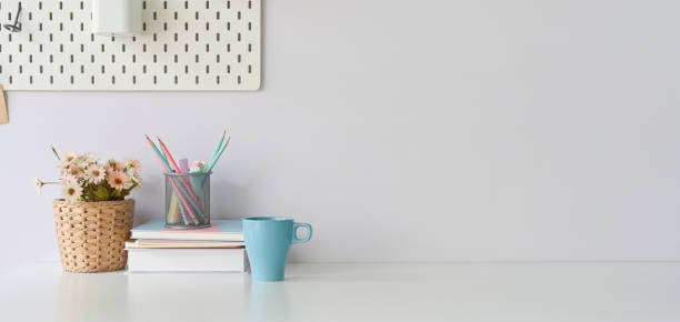 istock A comfortable workspace is surrounding by a ceramic coffee cup and accessories. 1247808193