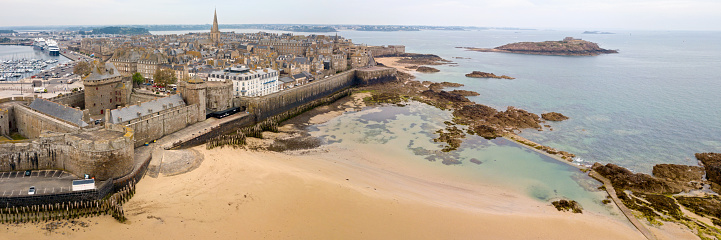 Saint-Malo, France - June 03 2020: Aerial view of the old town of Saint-Malo surrounded by the ramparts with the Castle of the Duchess Anne, the Quic-en-Groigne Tower and the cathedral.