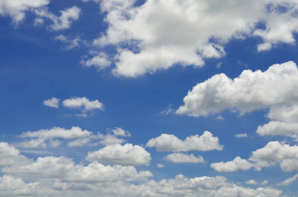 istock blue sky and white fluffy cloud horizon outdoor for background. 1247809514