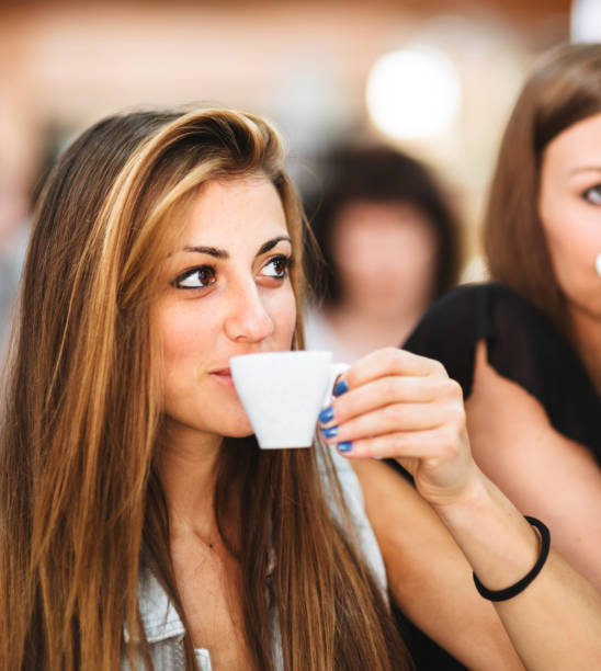 Portrait of a smiling young woman holding a glass of fresh clean purified drinking water. the concept of a healthy lifestyle and fluid intake