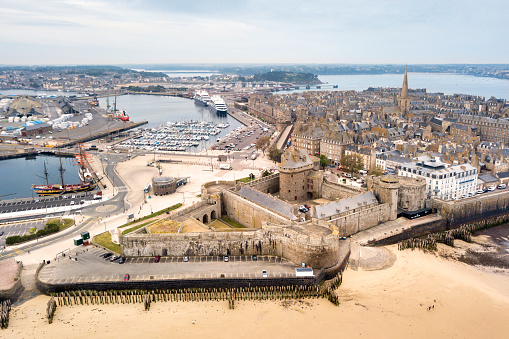 Saint-Malo, France - June 03 2020: Aerial view of the old town of Saint-Malo surrounded by ramparts with the Castle of the Duchess Anne, the Quic-en-Groigne Tower and the cathedral.