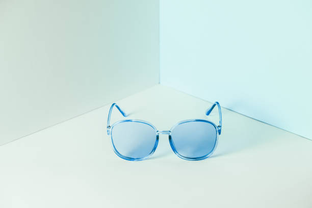 istock Stylish blue sunglasses on modern minimal pastel background, front view. Nobody. Product photograph 1247810691