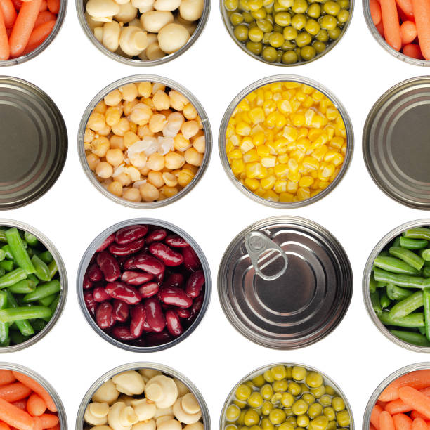seamless food background made of opened canned chickpeas, green sprouts, carrots, corn, peas, beans and mushrooms on white background - canned food imagens e fotografias de stock