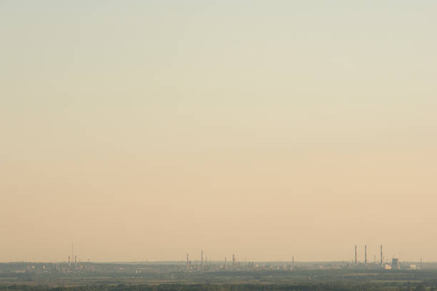 istock Factory with chimneys on a summer day. The problem of ecology and environmental pollution. 1247814040