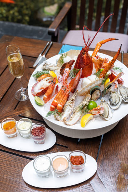 istock Seafood on ice with white wine 1247815190