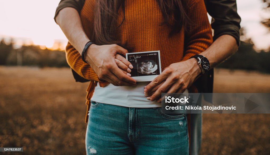 Couple with Baby Ultrasound Pregnant Stock Photo