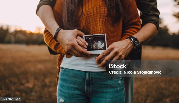Couple With Baby Ultrasound Stock Photo - Download Image Now - Pregnant, Ultrasound, Couple - Relationship
