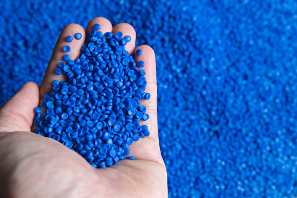 istock Blue plastic grain, plastic polymer granules,hand hold Polymer pellets, Raw materials for making water pipes, Plastics from petrochemicals and compound extrusion, resin from plant polyethylene. 1247827632