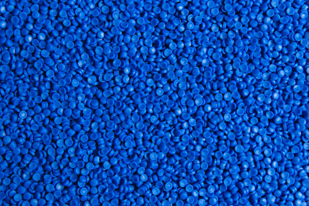istock Blue plastic grain, plastic polymer granules,hand hold Polymer pellets, Raw materials for making water pipes, Plastics from petrochemicals and compound extrusion, resin from plant polyethylene. 1247827706