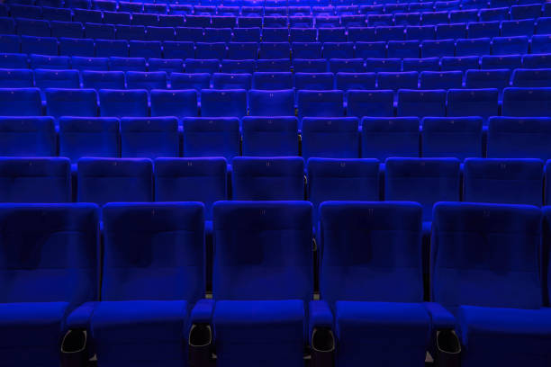 istock Absolutely empty blue chairs in cinema with nobody 1247827908
